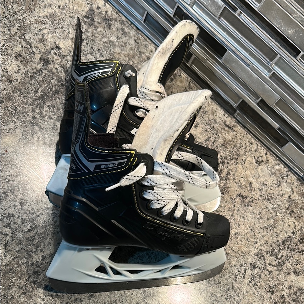 CCM Super Tacks Black and White Hockey Skates with Silver Accents